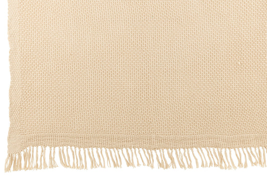 Beige gebreid plaid met franjes – zachte en warme woondeken in natuurlijke tint